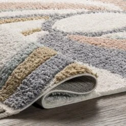 Theodora Colorful Swirl Kids Tassel Area Rug -Roommates Store GUEST 67e8978d 6c24 427b 8f73 9681478f1d12